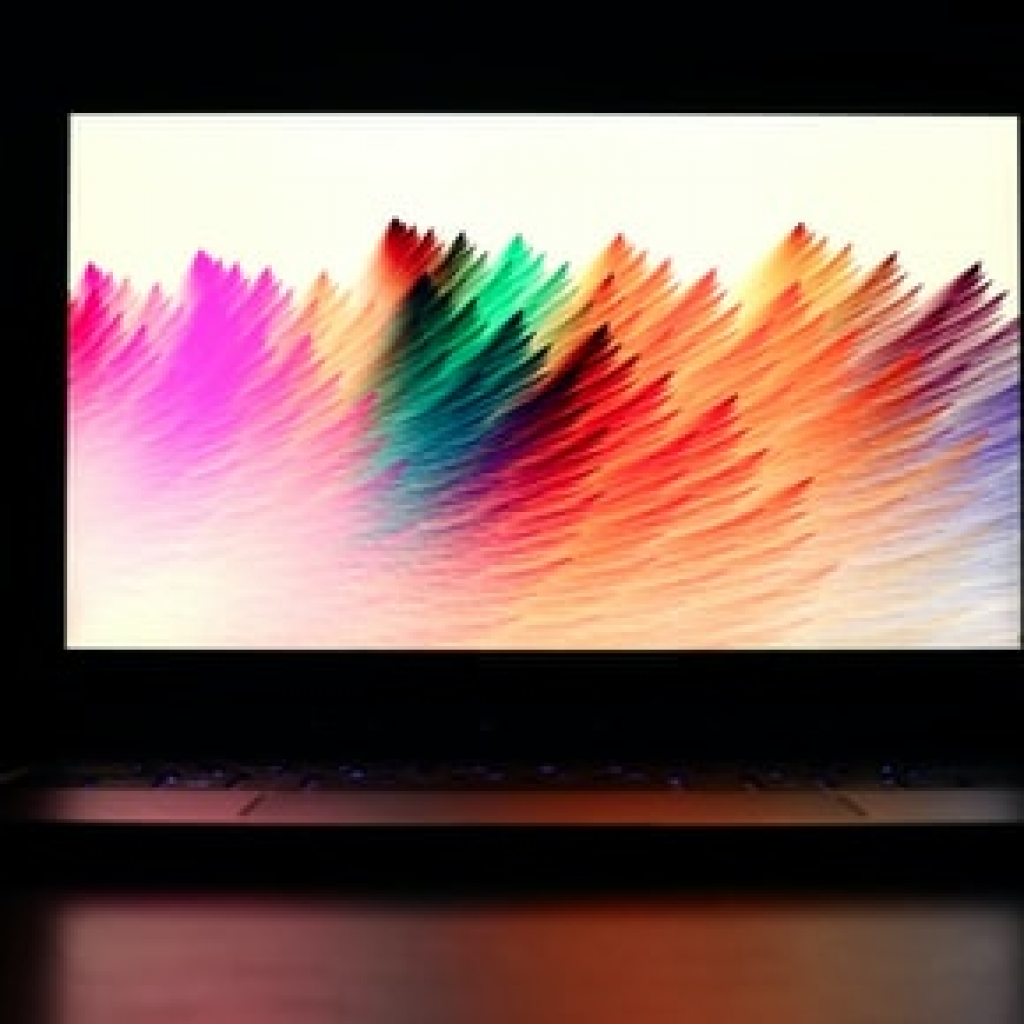 Ecran d'ordinateur portable avec une représentation colorée en vagues modernes